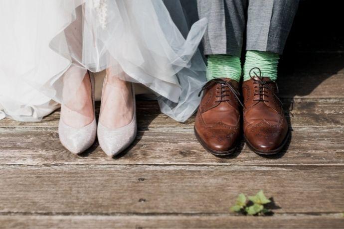 feet and shoes of a bride and groom 